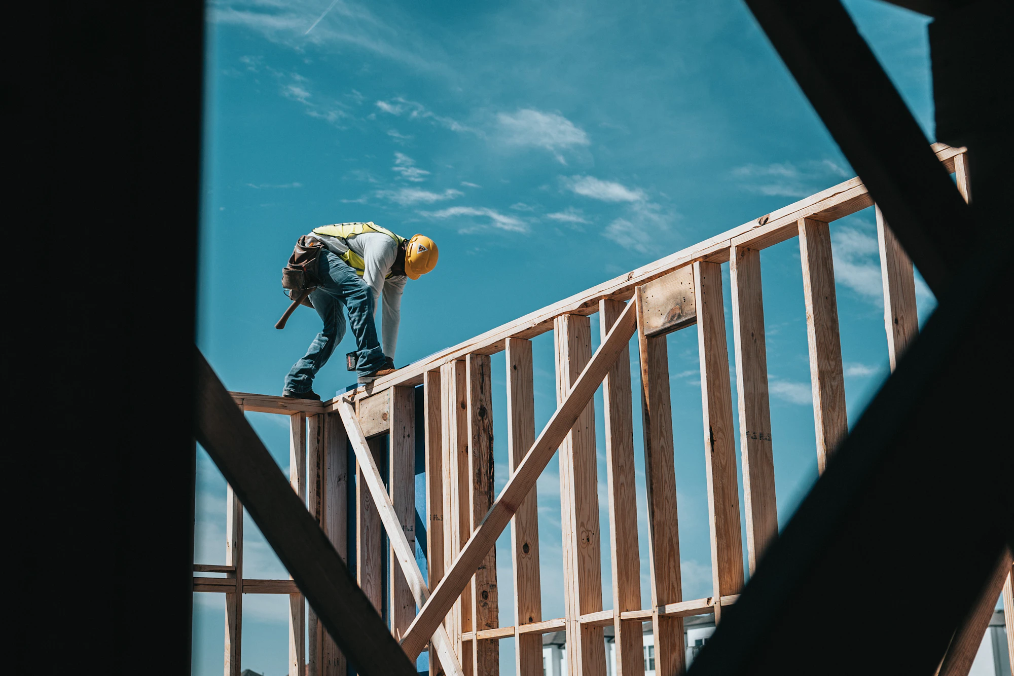 Construction worker on a building frame